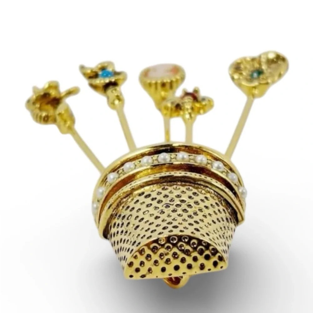 Vintage gold-plated thimble brooch with five stick pins.